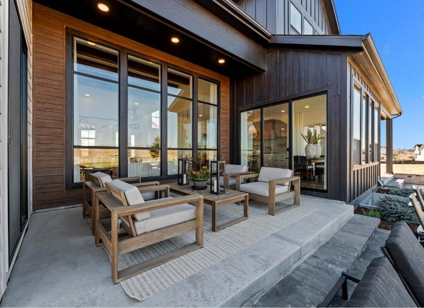A close-up of the sitting area on the deck outside the kitchen in the Serenity showhome, a new luxury two-story home in Vivant, with a cozy and inviting design. This is in Cardel Homes’ newest Douglas County community, located on the east side of Parker, Colorado.