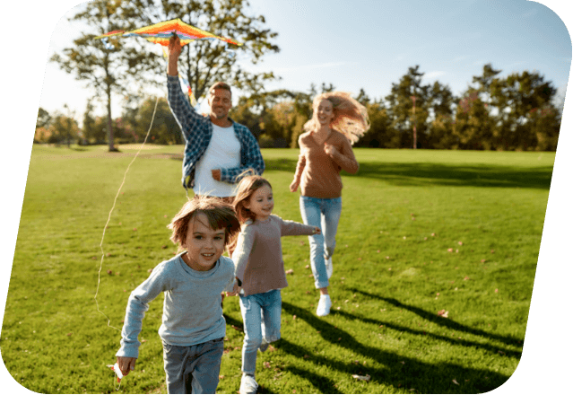 Happy family playing a kite