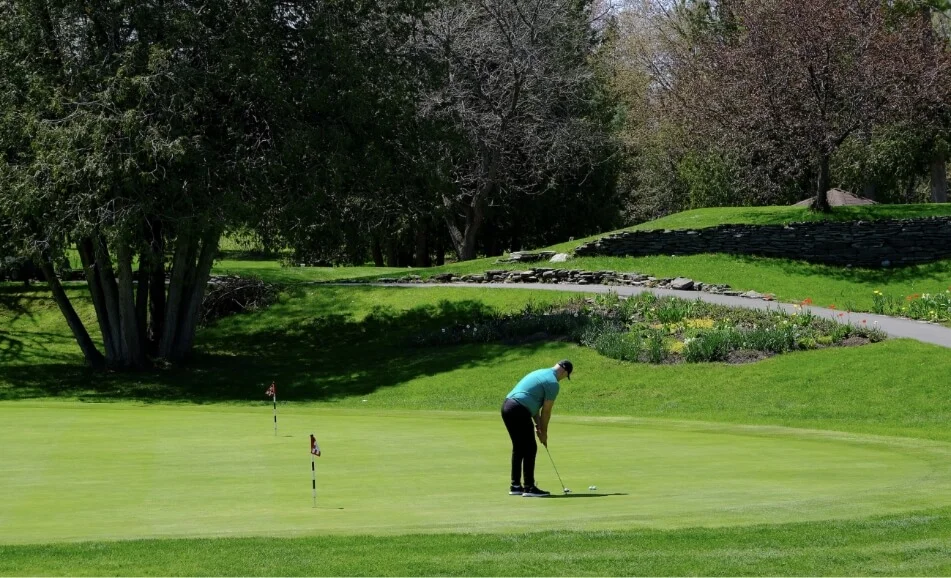A person playing golf on a golf course. This is for the Cardel community of Morris Village in Clarence-Rockland.