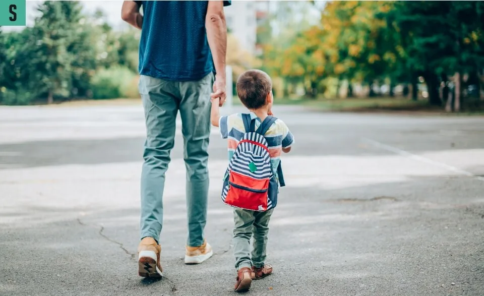 Kid with backpack in Silverton neighbourhood