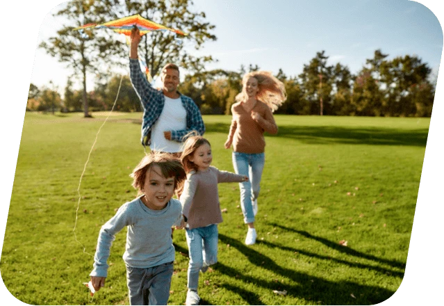 Happy family playing a kite