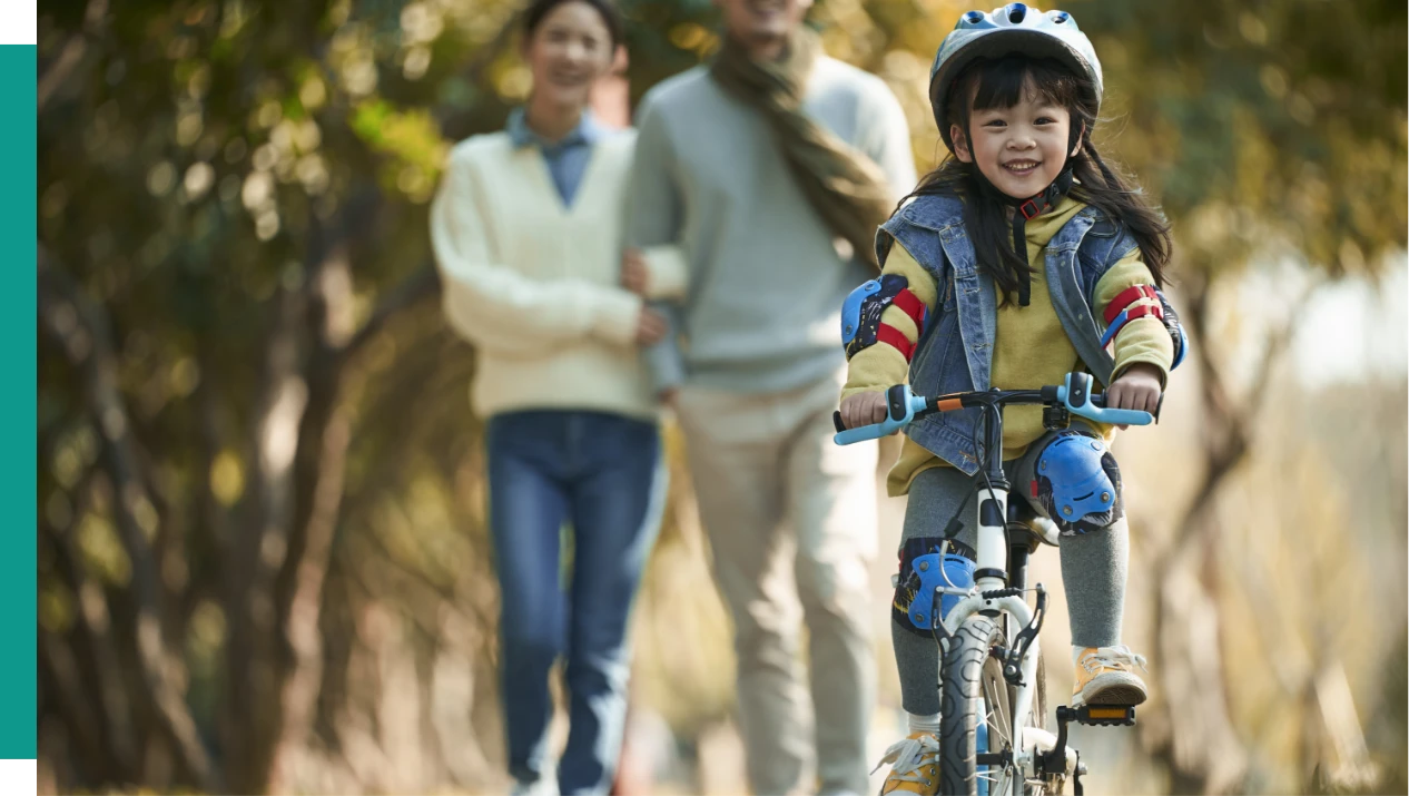 Woman biking on trail