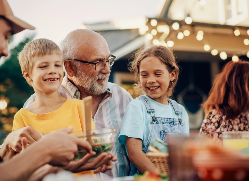 grandfather grandchildren patio dinner
