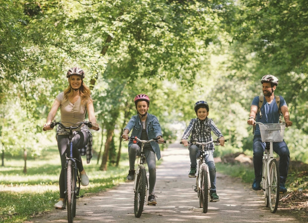parents kids bike riding outdoors