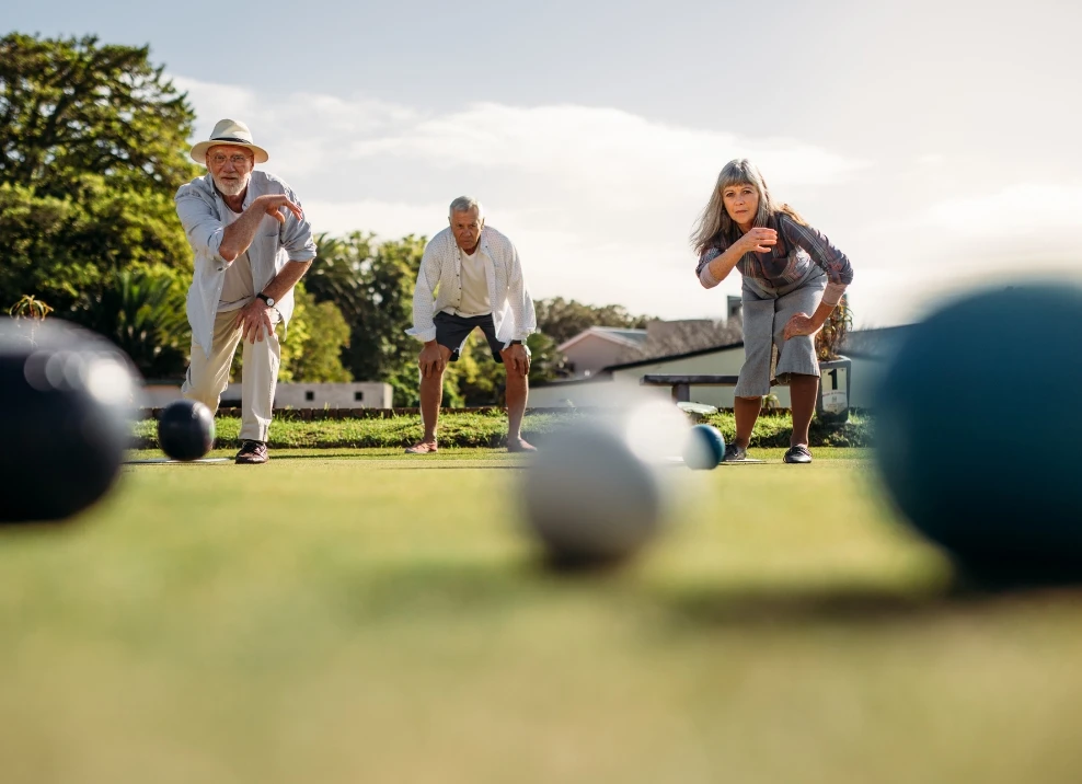 seniors playing lawn bowling